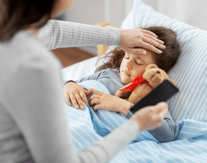 parent feeling forehead of child